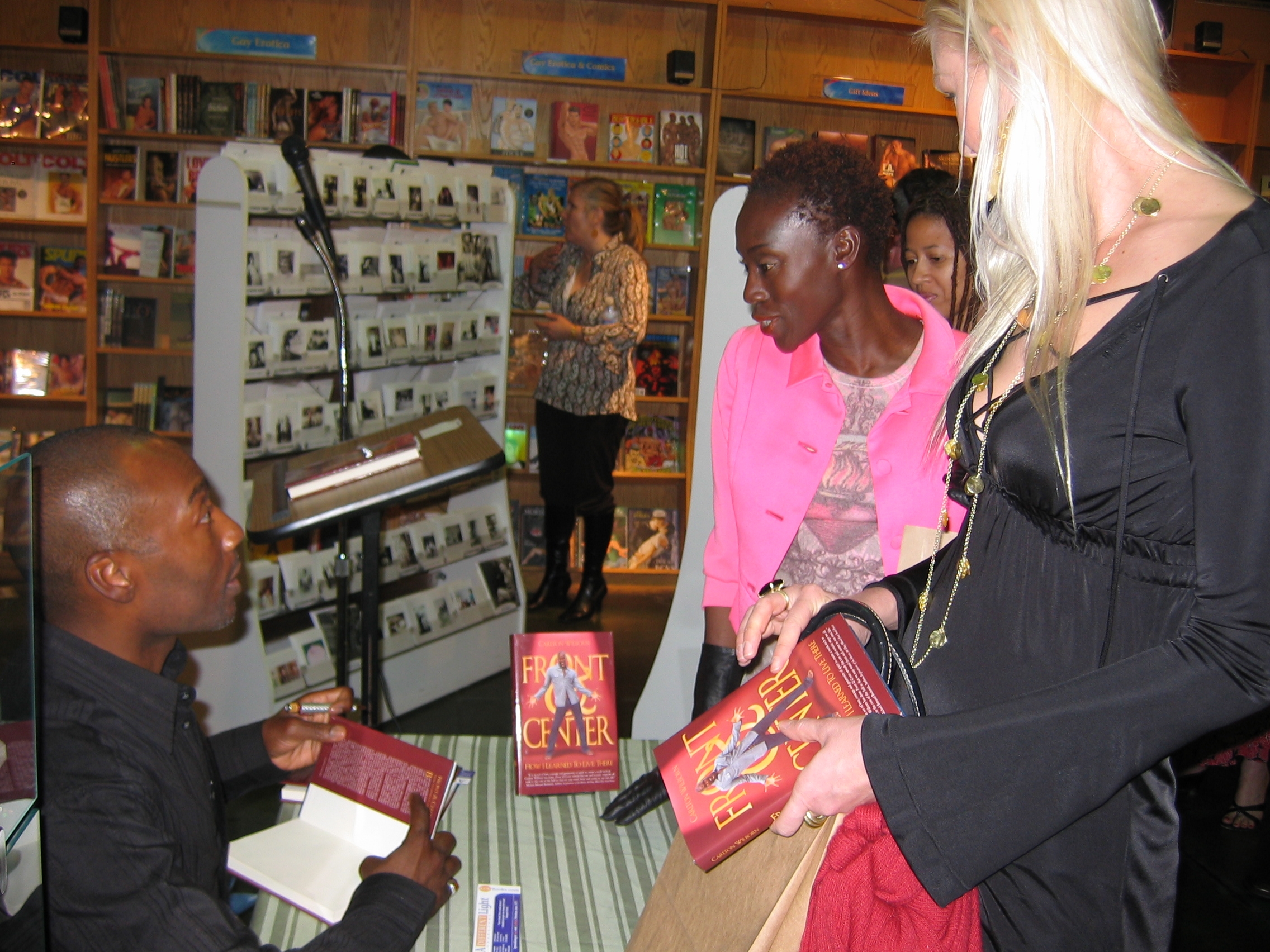 Carlton signing his award-winning book Front & Center - How I learned To live There, for Sharon Ferguson and Heather Caps.