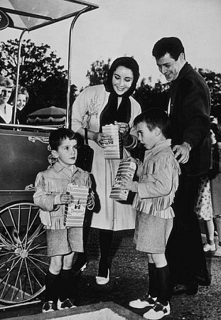 Elizabeth Taylor with fourth husband Eddie Fisher and sons Christopher and Michael Wilding Jr. C. 1960