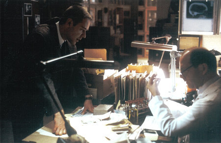 Bud White (Russell Crowe) and Ray Pinker (Gene Wolande) uncover important evidence in L.A. CONFIDENTIAL.