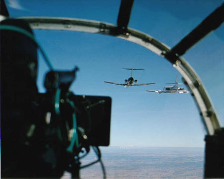 From 'Cliffhanger' filming the mid-air stunt transfer of a man from one plane to another.