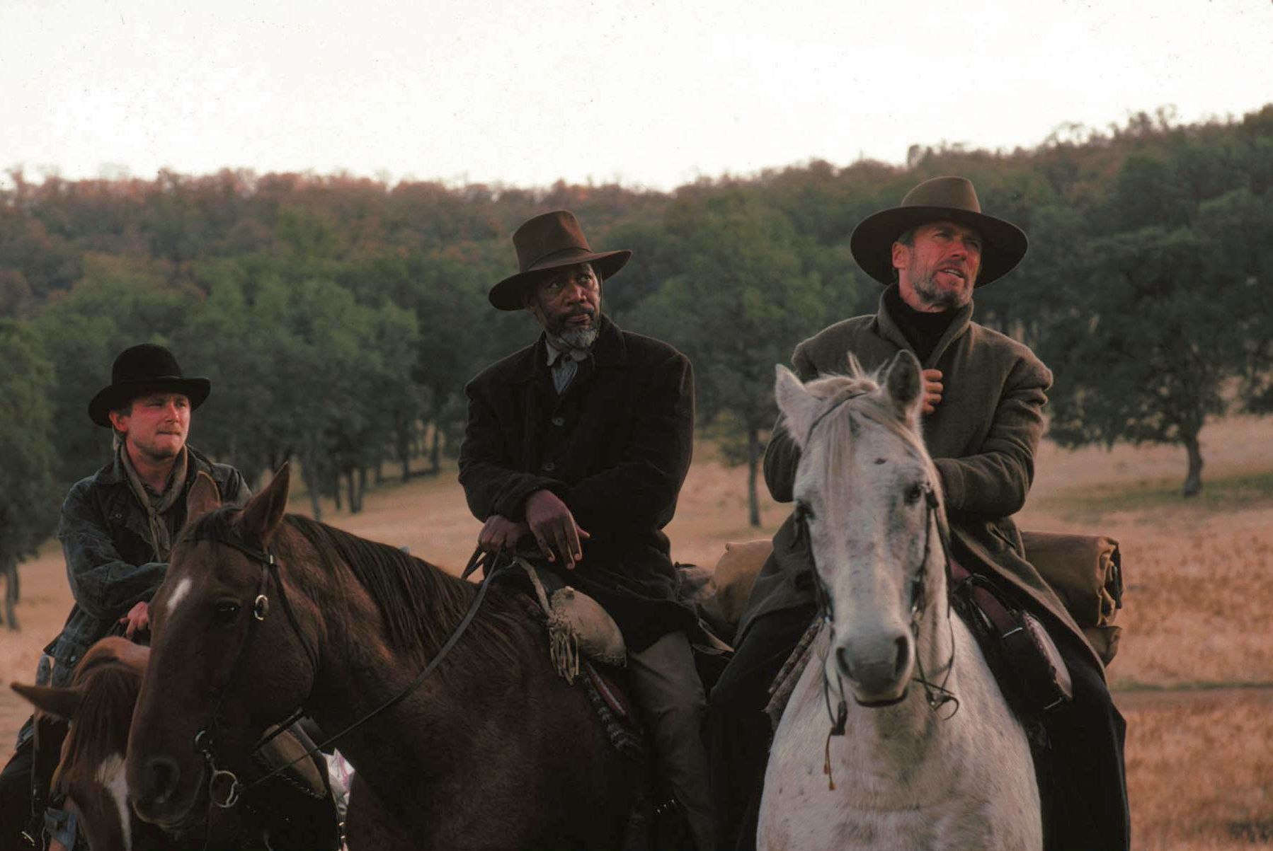 Still of Clint Eastwood, Morgan Freeman and Jaimz Woolvett in Menantis pikta (1992)