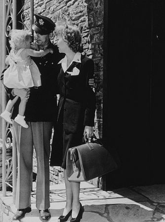 Ronald Reagan with wife Jane Wyman and their daughter Maureen, saying their goodbyes as he prepares to leave for the army