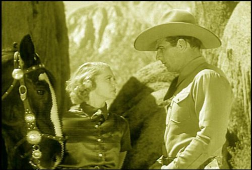 Tom Tyler and Carol Wyndham in Roamin' Wild (1936)