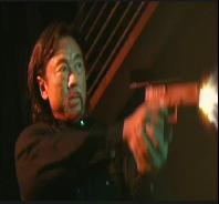 Hitman fires his handgun at FBI agent in nightclub.