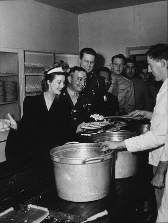 Loretta Young boosting morale at an Army base C. 1944