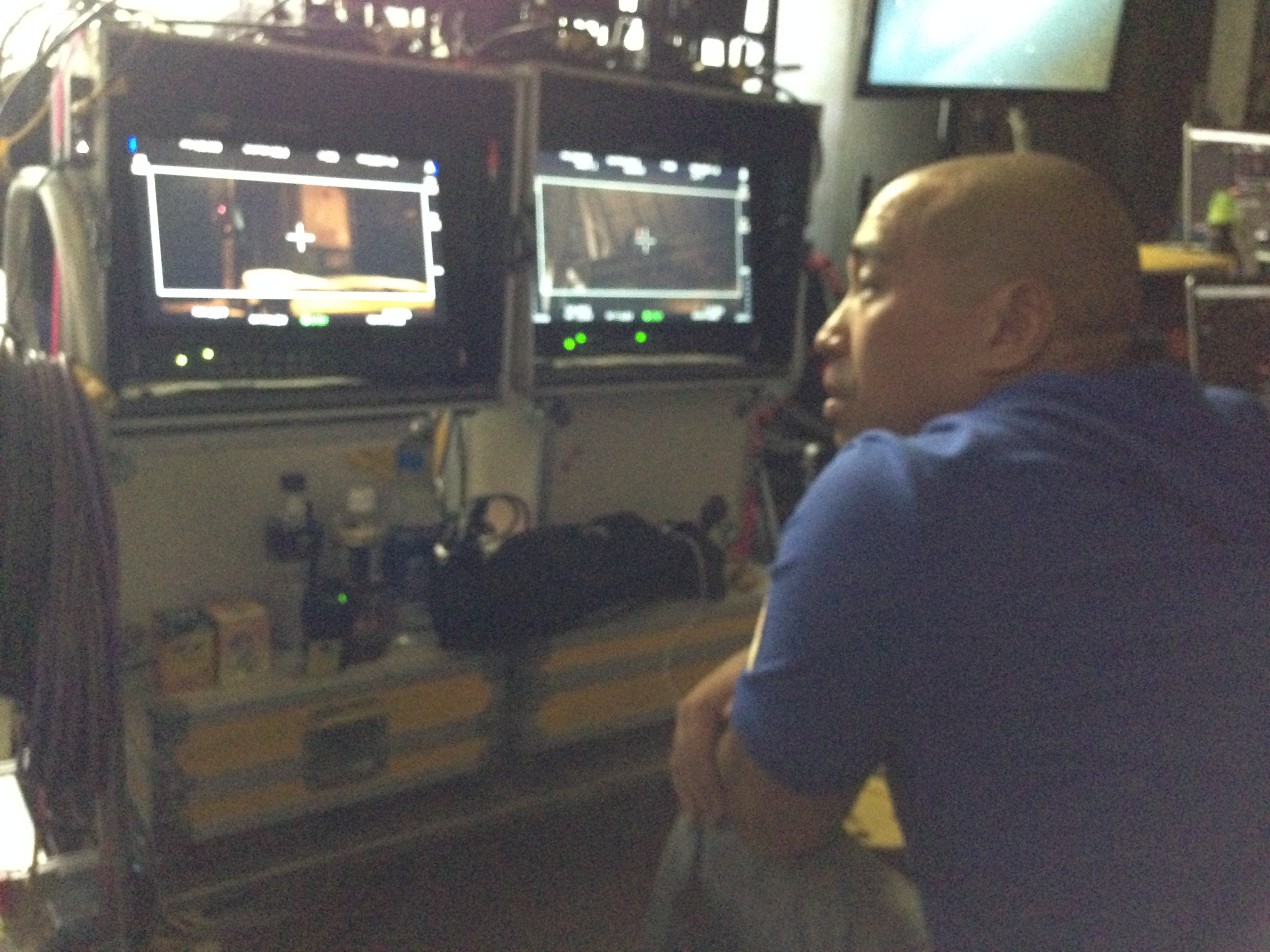 Action Director Ron Yuan watches playback on the set of 