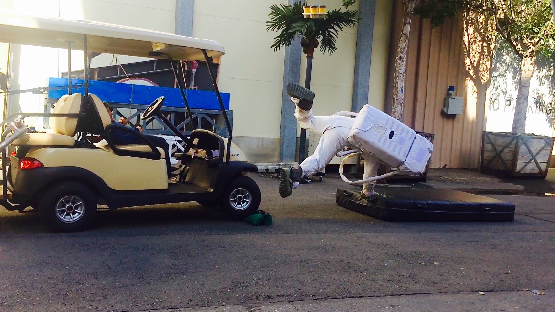 Stuntman James Zahnd taking another hit in his Astronaut suit by a golf cart.