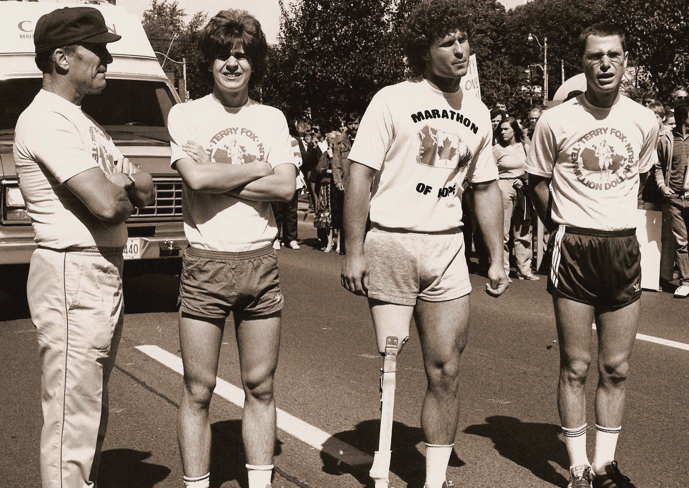 Robert Duvall, Chris Makepeace, Eric Fryer, and Michael Zelniker on set for THE TERRY FOX STORY