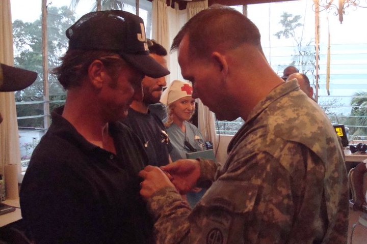 sean penn- oscar gubernati alison thompson receiving medals of excellence from LTC Foster and 82nd airborne haiti 2010