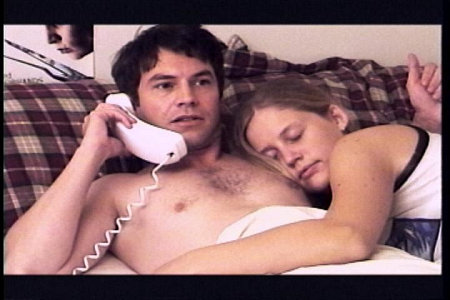 Nick (Harley Kaplan) & Krista (Janet Dougherty) in bed.