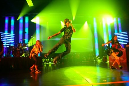 Jumping and performing on stage.