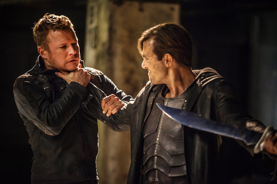 Still of Christopher Egan and Carl Beukes in Dominion (2014)