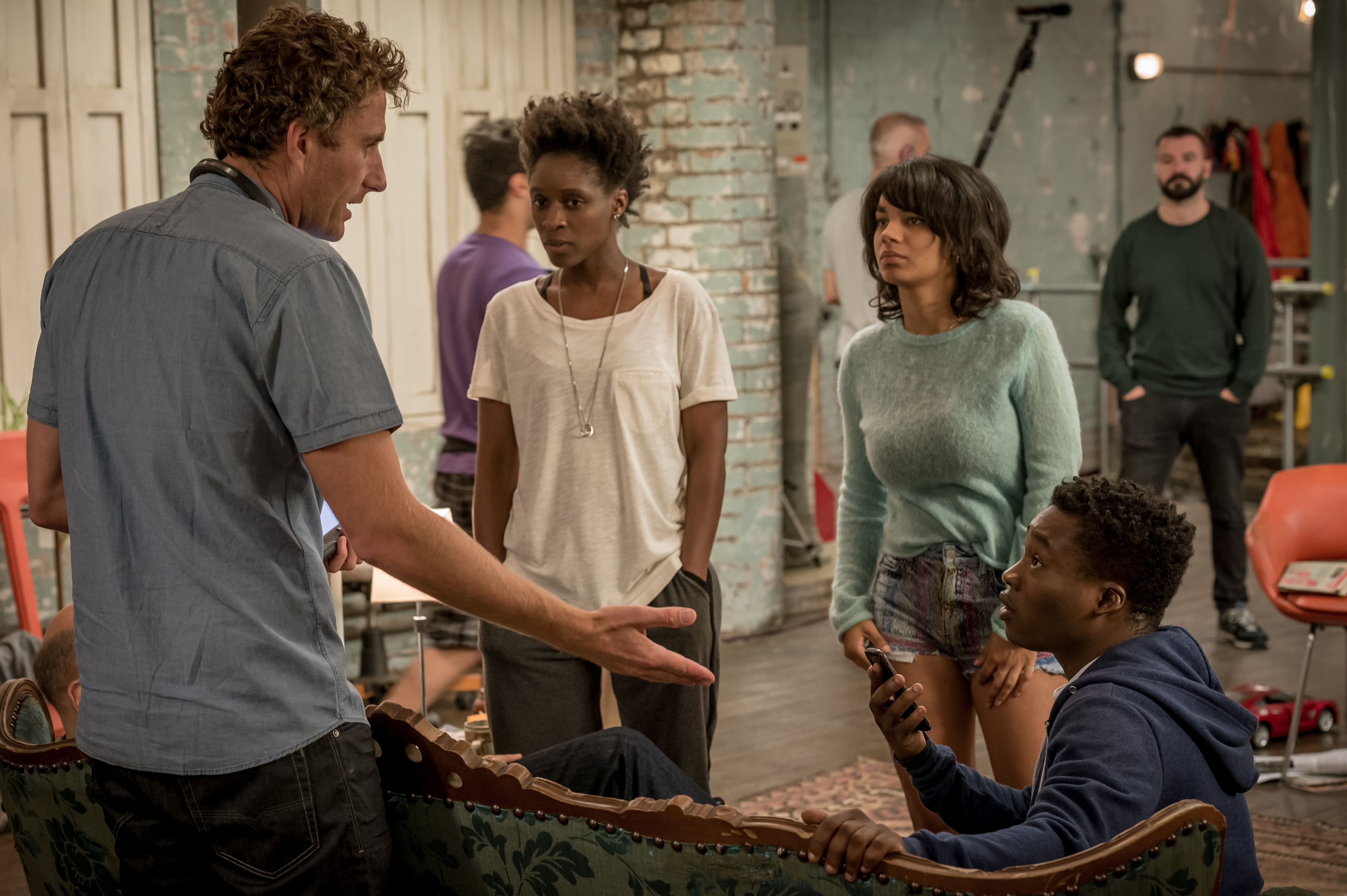 Still of director Euros Lynn, with Sharon Duncan-Brewster, Red Madrell and Fisayo Akinade on the set of 'Cucumber'(2015).