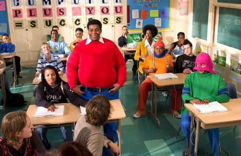 Doris (Kyla Pratt, seated left) brings her new friends, Fat Albert (Kenan Thompson) and the Cosby Kids to class with her. Fat Albert's pals are (back row, L-R) Bill (Keith D. Robinson), Bucky (Alphonso McAuley) and Old Weird Harold (Aaron A. Frazier). In the middle row are schoolmates played by Aaron Carter (L) and Joel Madden (R) seated beside Mushmouth (Jermaine Williams, center). Dumb Donald (Marques B. Houston) is seated in the front row on the right.
