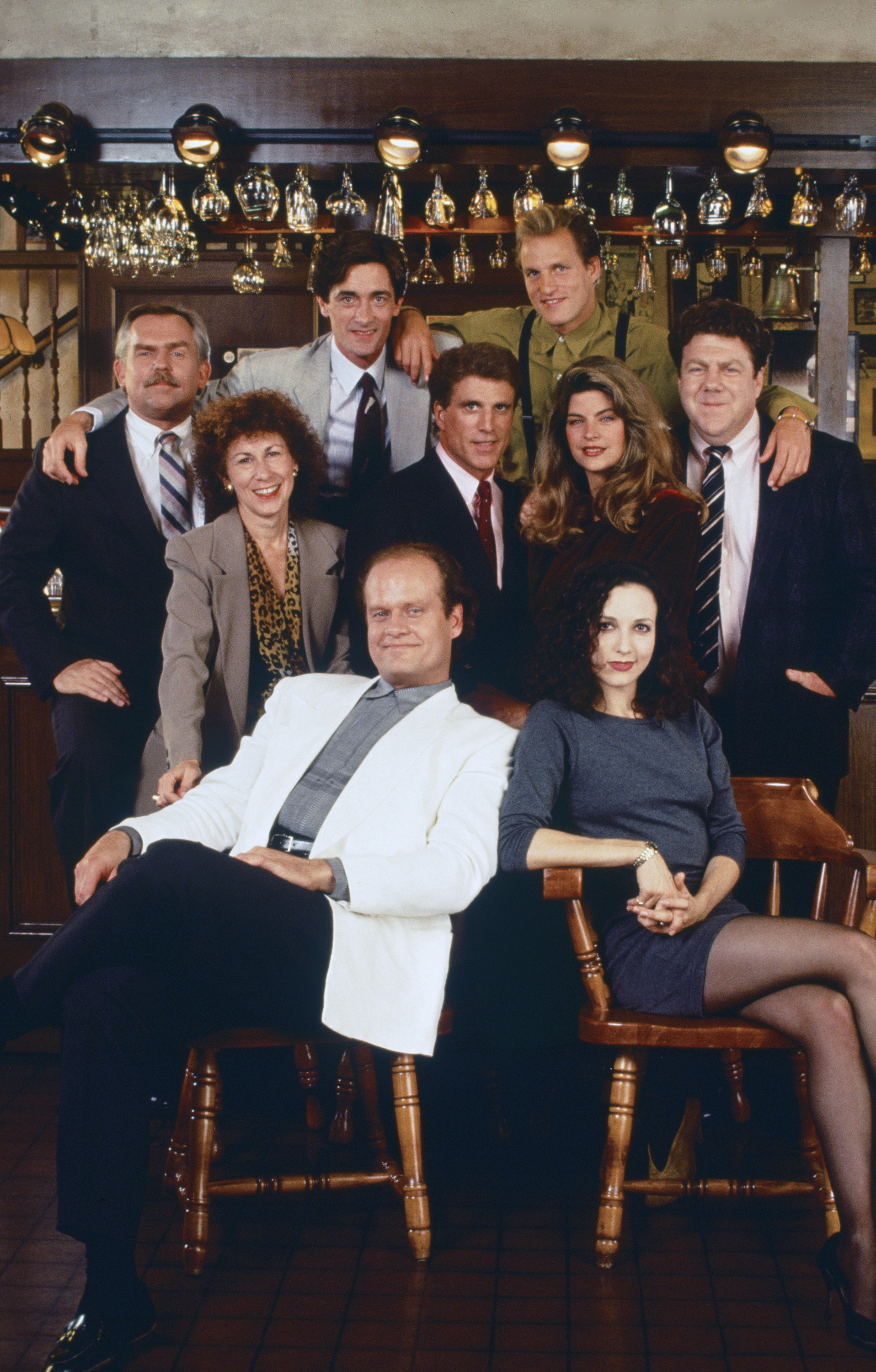 Still of Kirstie Alley, Woody Harrelson, Ted Danson, Kelsey Grammer, Bebe Neuwirth, John Ratzenberger, George Wendt, Rhea Perlman and Roger Rees in Cheers (1982)