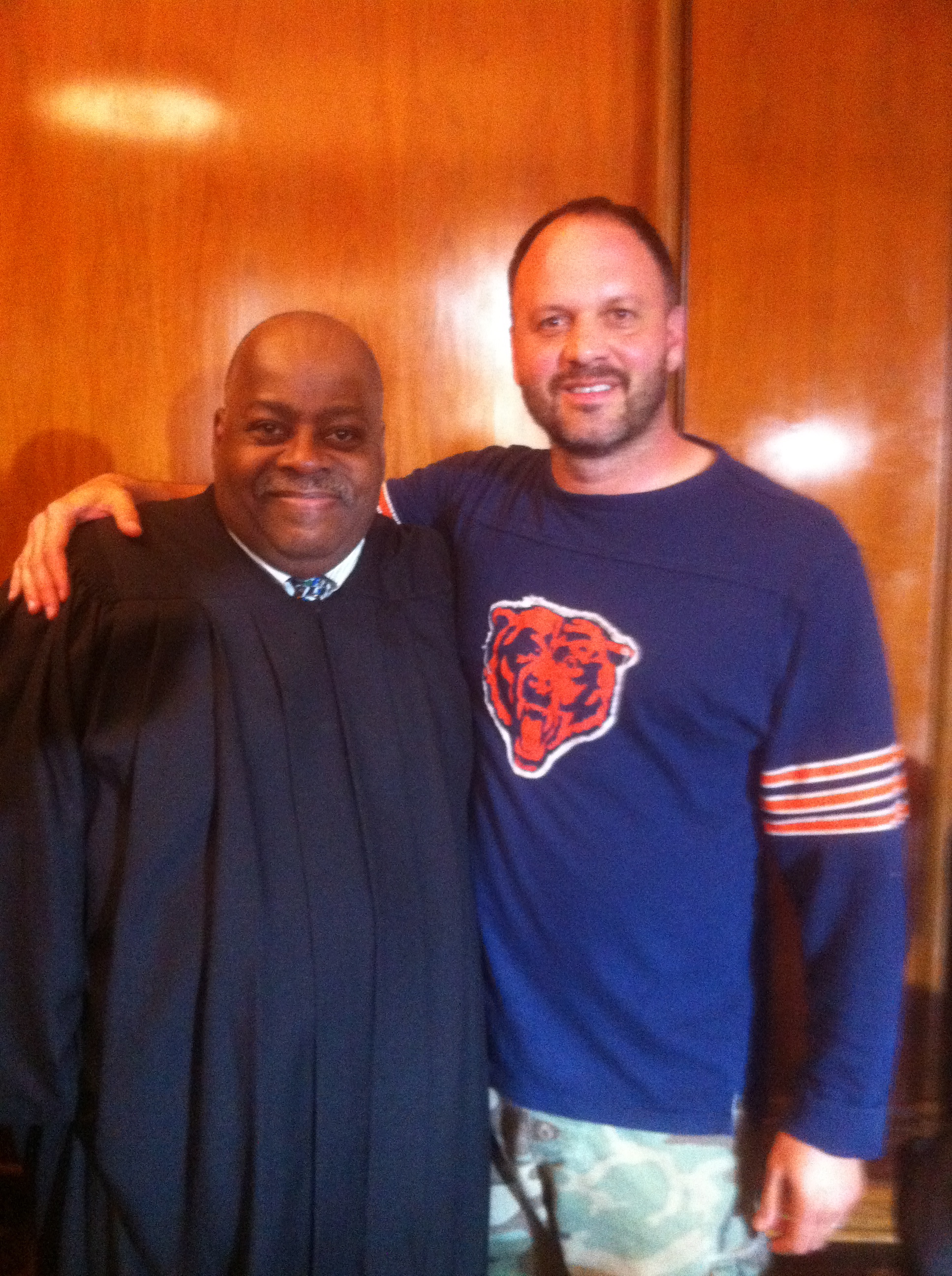 Reginald VelJohnson playing Judge Morris in courtroom scene of 'Strike One' with director and Chicago Bears fan Me!