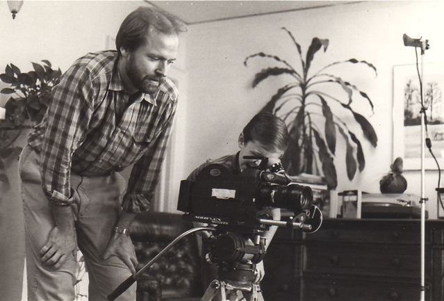 Erik Friedl turning over the camera to young thespian during filming of 