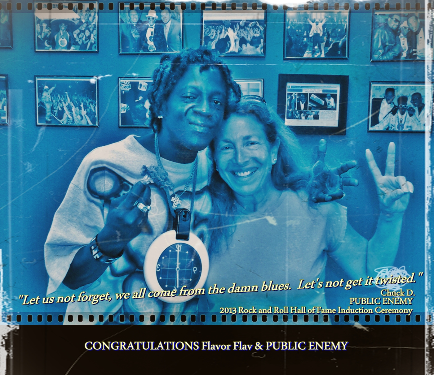 2013 Rock and Roll Hall of Fame Inductee PUBLIC ENEMY'S Flavor Flav and Daena Smoller enjoying a delicious piece of Flav's fried chicken.