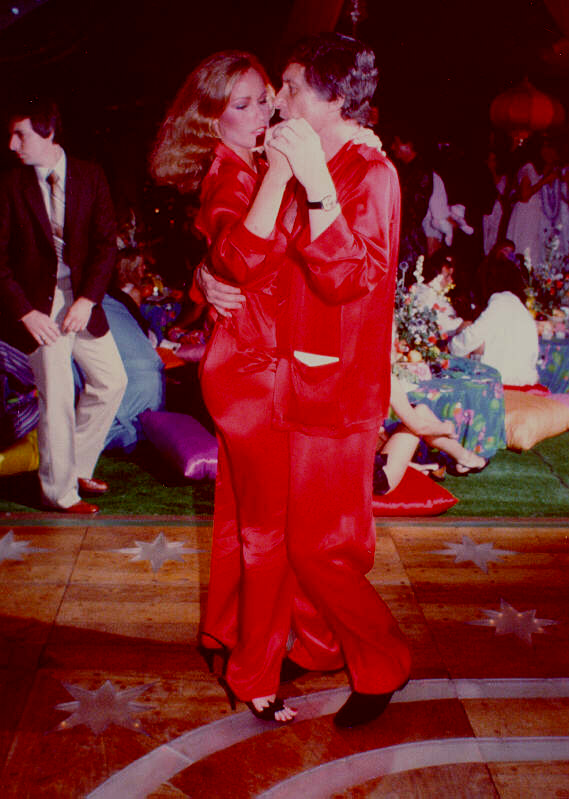 1981, Playboy Mansion (West) Pajama Party. L-R: Hugh Hefner bodyguard Larry Montz, July 1977 Playboy Playmate Sondra Theodore, Hugh Hefner.