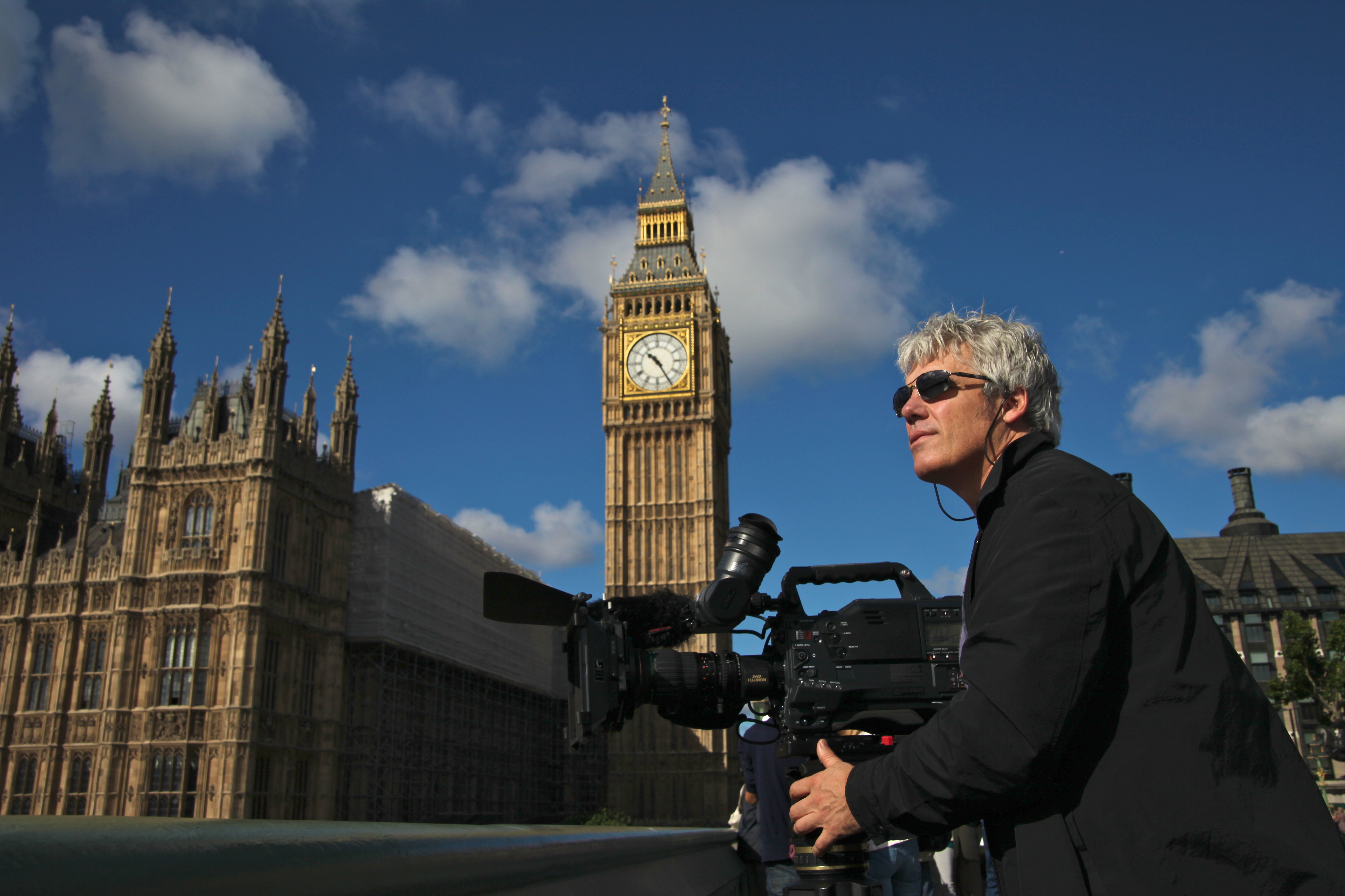 Director Peter von Puttkamer lines up a shot in London, England, for: 