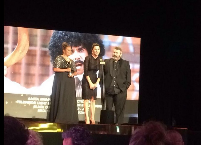 Bec Cole and Craig Anderson accepting the award for Best Director in Television Light Entertainment or Reality for Black Comedy. Joined by writer/performer Elizabeth Wymarra.