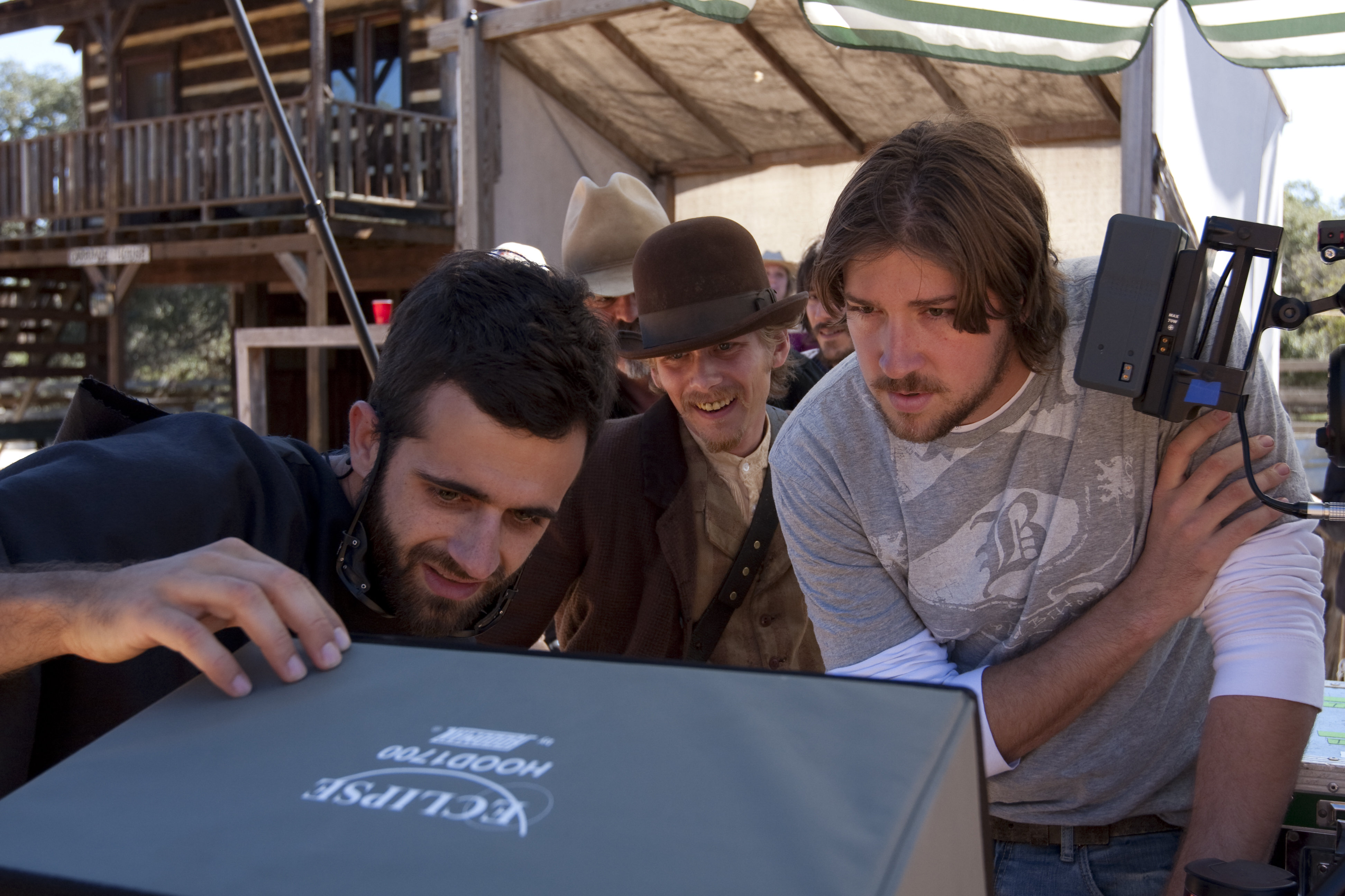 Director Tanner Beard watches playback with Director of Photography Nathanael Vorce and Actor Lou Taylor Pucci.
