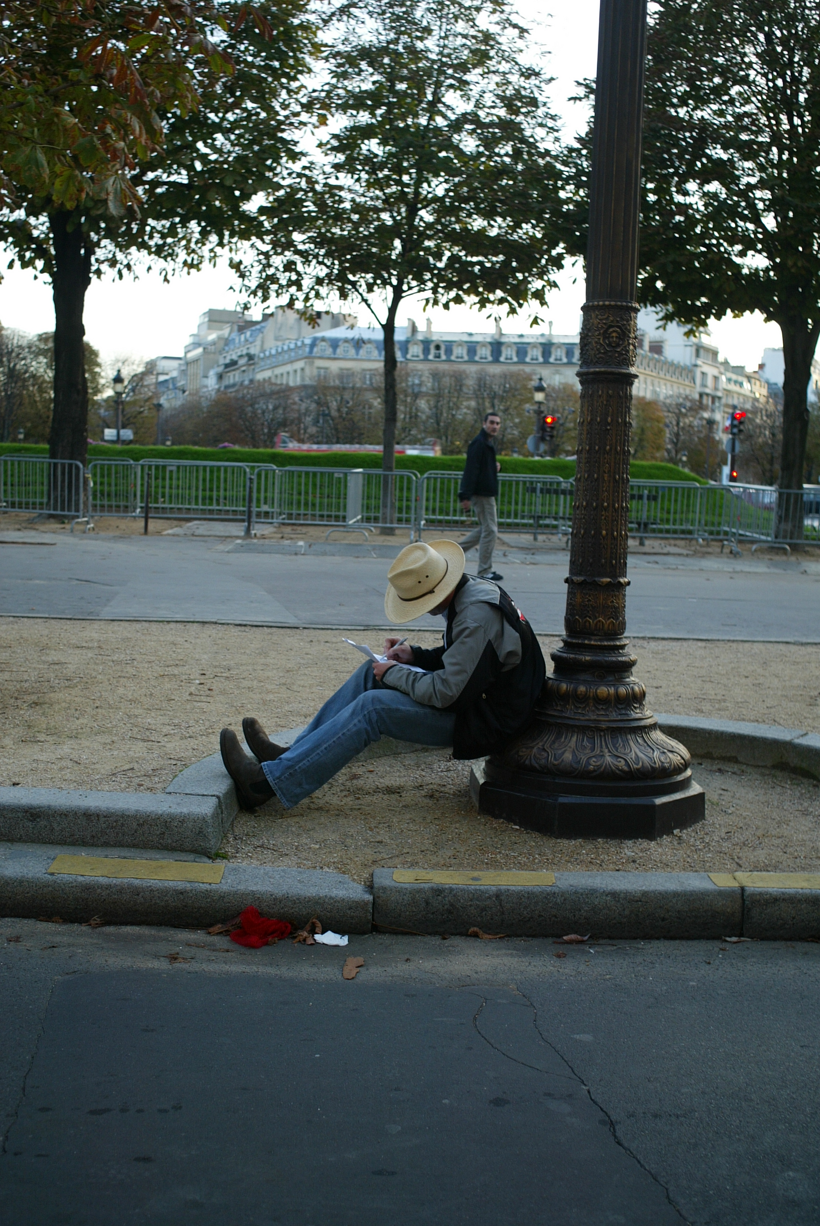 Jim works on the script for THE WRITER on the Champs Elysee, Paris.