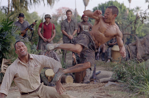 The Rock fights Ernie Reyes Jr. as Seann William Scott looks on.