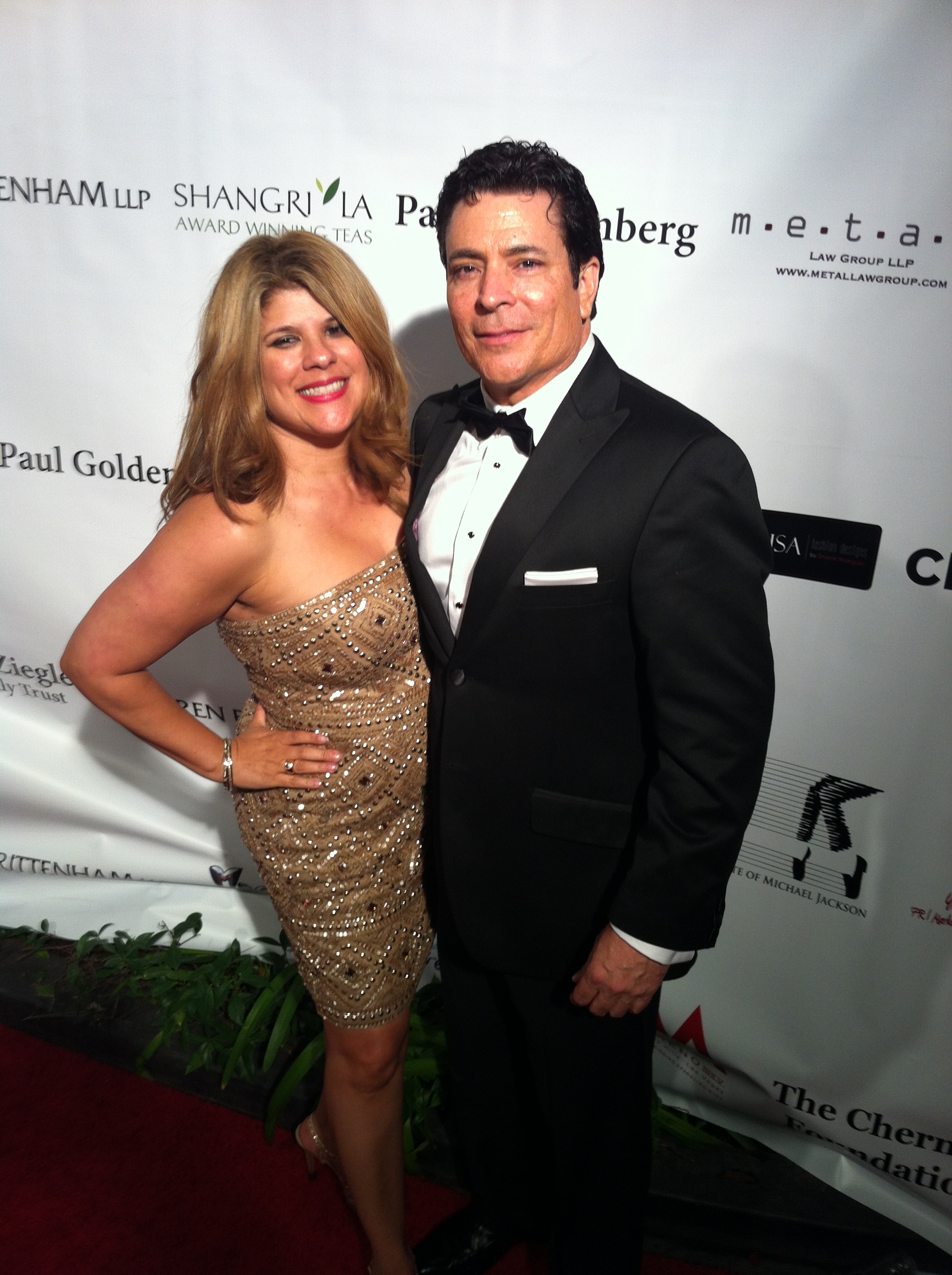 Writer/Director Daniel R. Chavez with publicist Yvette Morales of YM & Associates on Red Carpet at Children Uniting Nations Oscar after party in Beverly Hills,CA