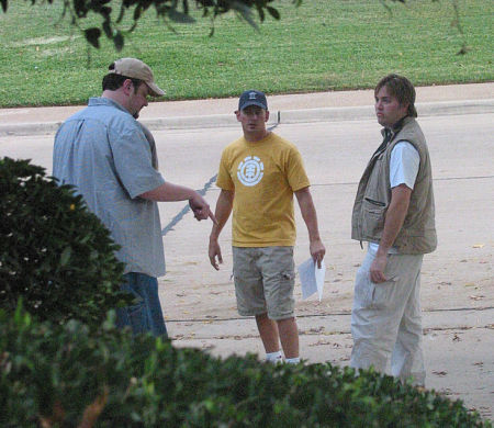 (left) Producer, Bill Lowry, (middle) director, Tim Holland (II) and (right) writer, Brad Thompson (V) discuss a location shoot on the short film, 