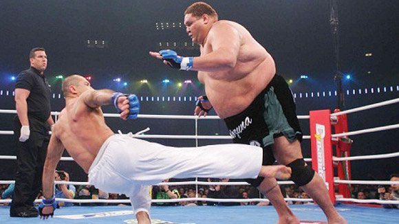 Royce with largest opponent.. Sumo wrestler