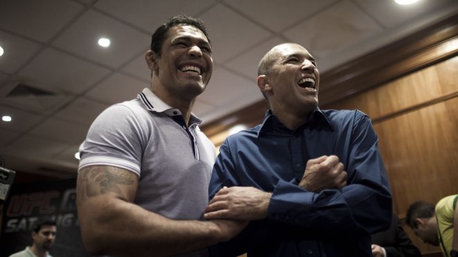 Brazilian Mixed Martial Arts (MMA) legend Royce Gracie, right, jokes with Brazilian MMA fighter Minotauro Nogueira share a light moment before the start of a news conference in Rio de Janeiro, Brazil, Thursday Aug. 25, 2011. The MMA organization, the Ulti