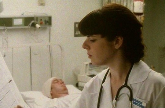 Joanna Jeffrees as Nurse Angell in 'Bribery & Corruption' alongside Tim Woodwood.