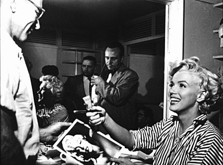 Signing autographs. c. 1954