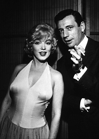 M. Monroe & Yves Montand at a press party for 