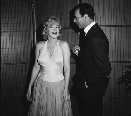 M. Monroe & Yves Montand at a party for 