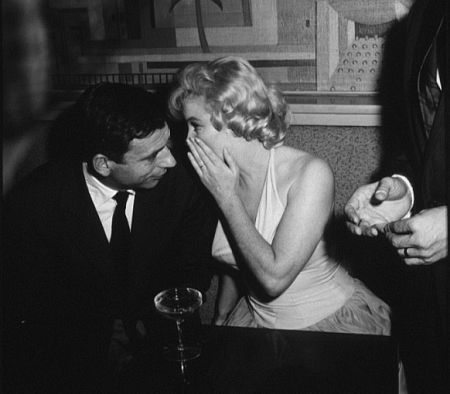 M. Monroe & Yves Montand at a party for 