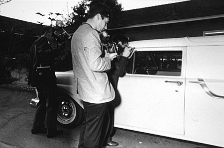 Monroe's hearse being swarmed by photographers. 8-5-62