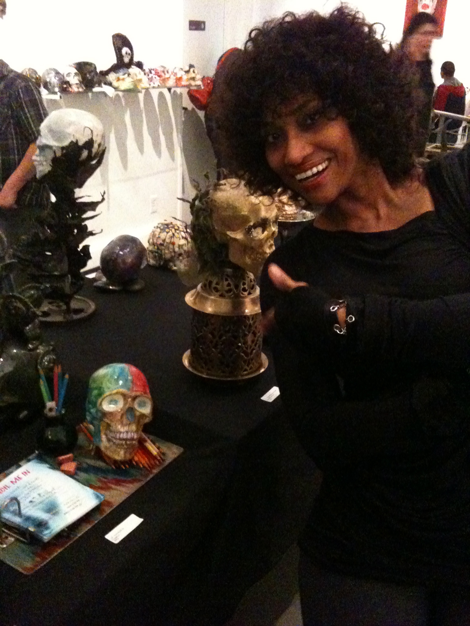 Artist/ Actress Pamella D'Pella poses with her art piece 