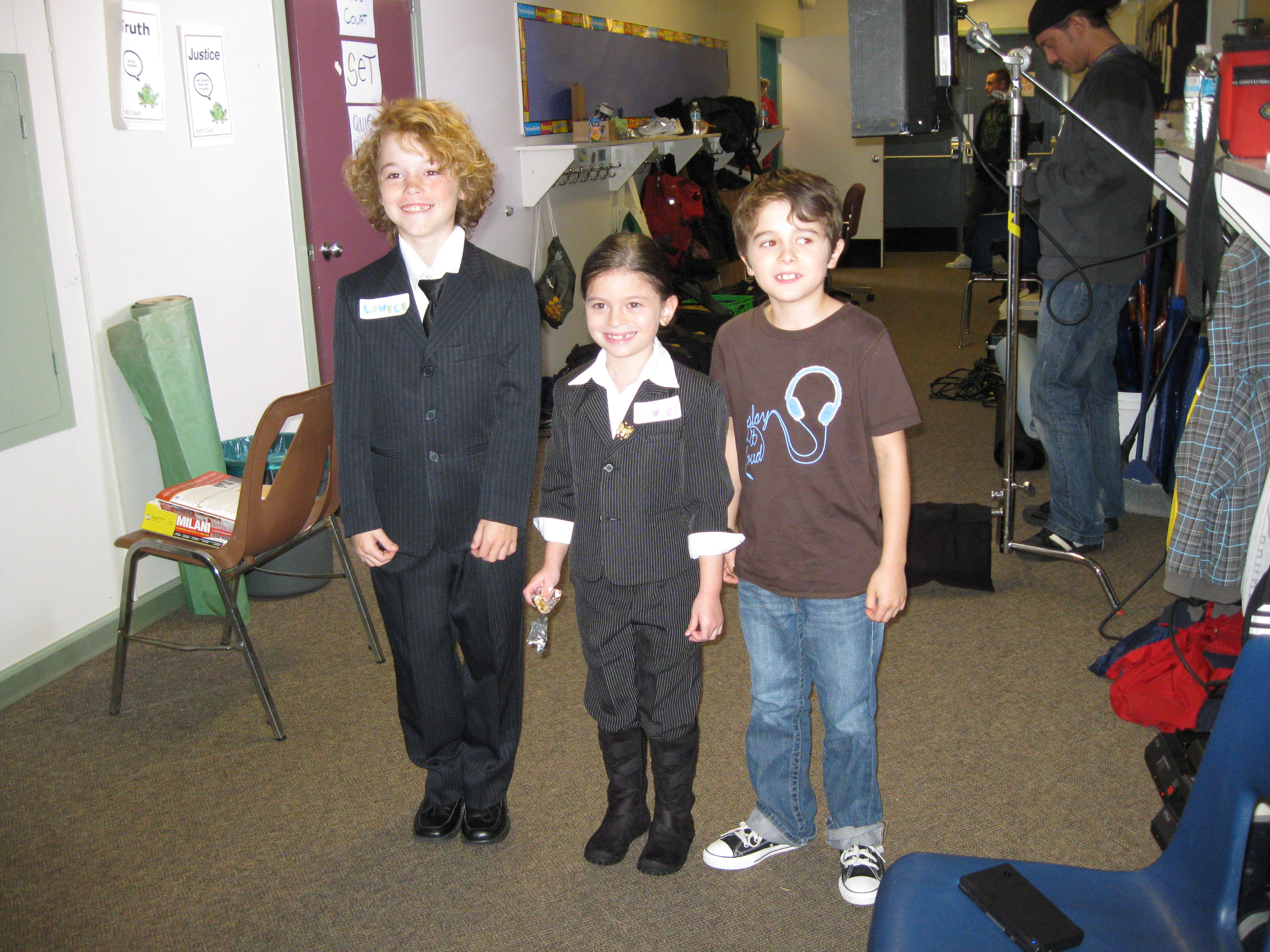 Dalila Bela, Connor Levins & Valin Shinyei on the set of 