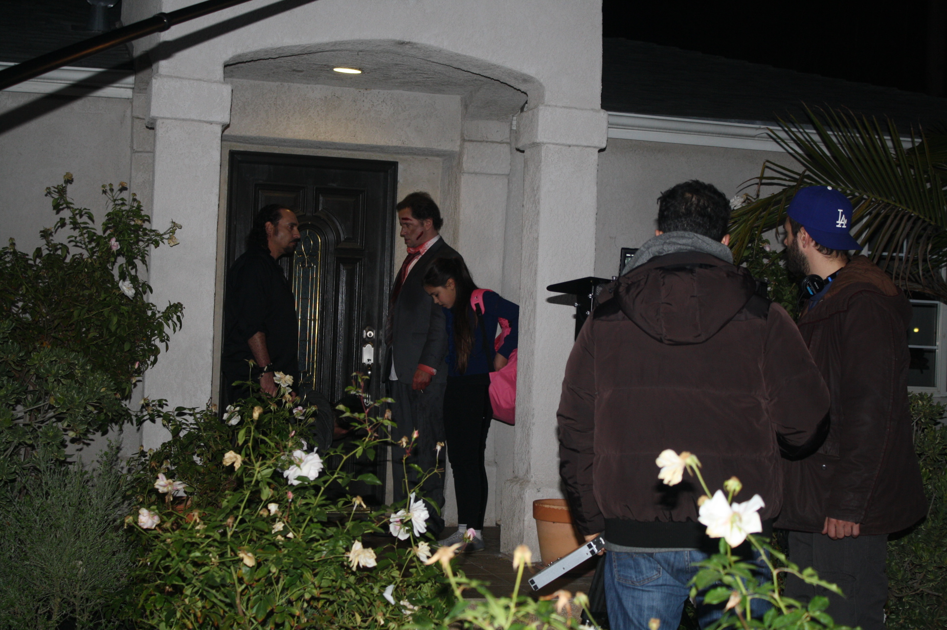 Sam Osman (left) and Jamie Kennedy (right) at the front door of the house, getting ready for a Film Scene on the set of 