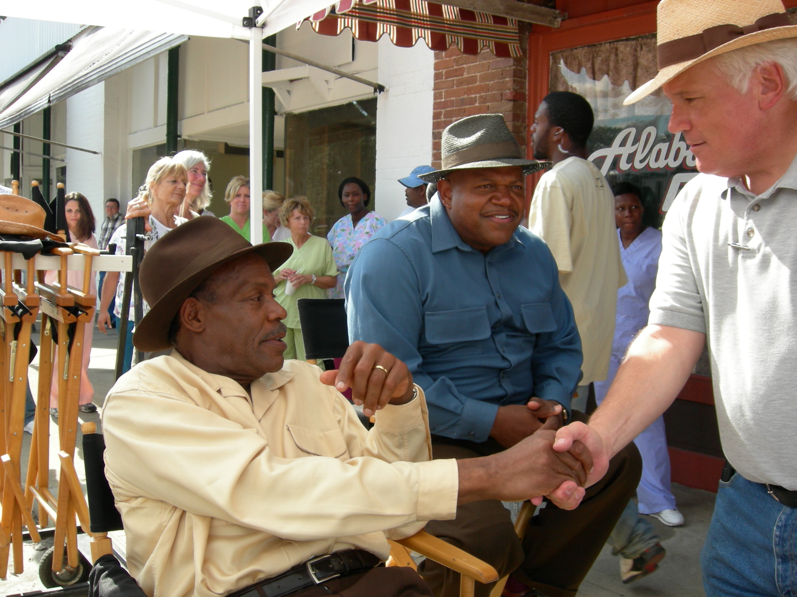 On Location. Honeydripper. 2006. Key tallent often takes note of RTMS efforts to create safe working conditions. Danny Glove and Keb Mo visit with Art after a long hot day of production work.