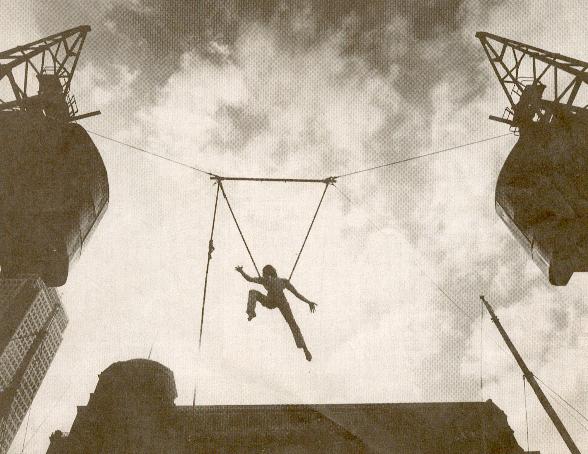 Photograph from the Independent of me playing on the cloud swing to promote the International Circus Festival