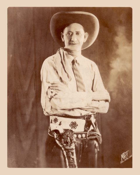 Bee Ho Gray, circa 1924, wearing his Colt six-shooter, Comanche beaded belt and throwing knive.