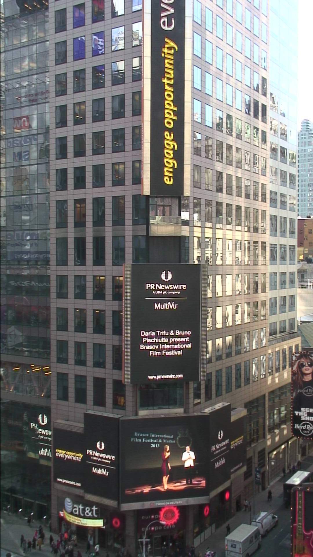 The photo of Bruno Pischiutta and Producer Daria Trifu presenting the Brasov International Film Festival & Market is featured in Times Square, New York City