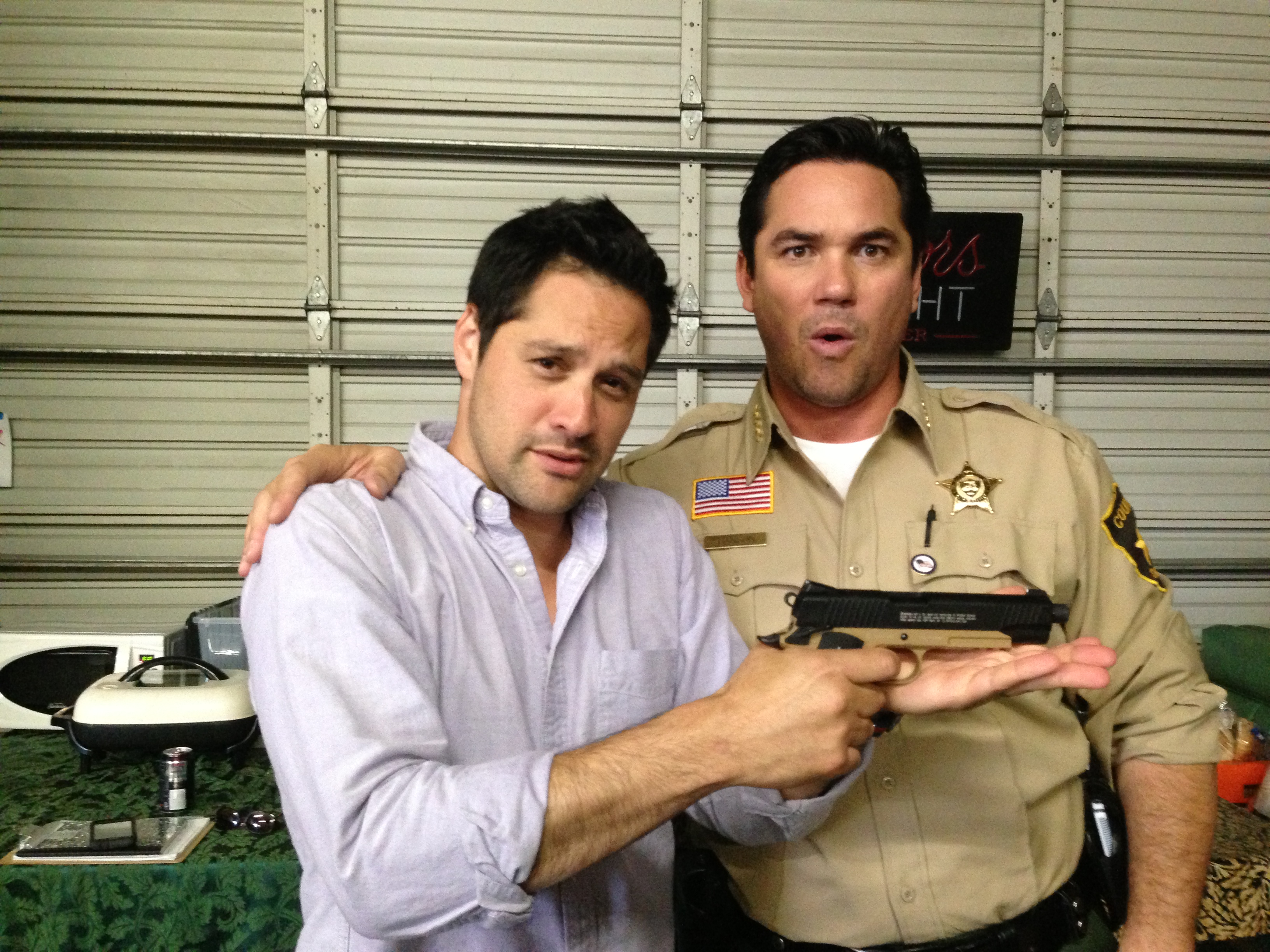 Seth Menachem and Dean Cain playing on the set of Defending Santa.