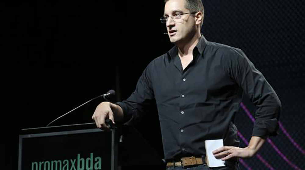Matt Checkowski speaking on stage at Promax/BDA (2014)