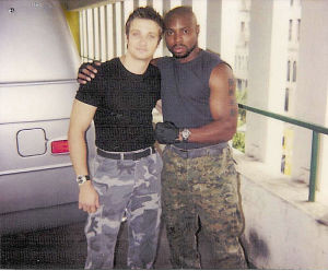 Page Kennedy as Travis in S.W.A.T. (2003)[pictured with Jeremy Renner]