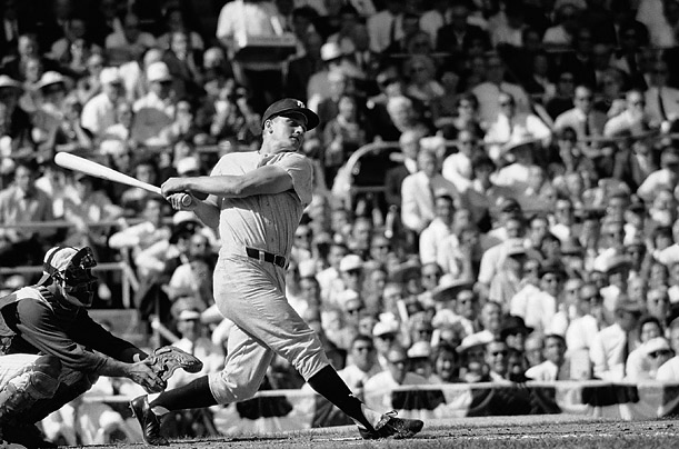 Roger Maris of the New York Yankees hits his 61st home run on October 1, 1961. Roger was and is my only sports idol. The catcher is Boston Redsox's Russ Nixon.