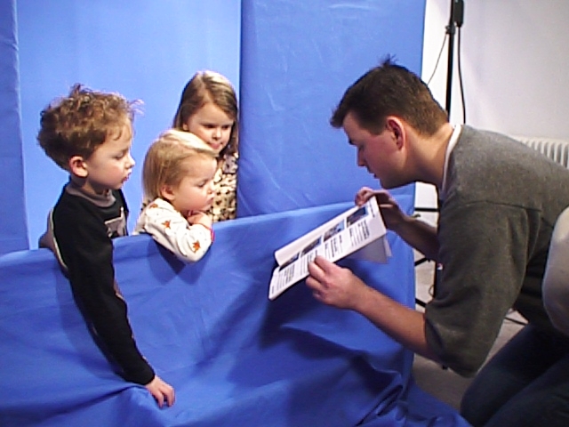 Directing kids for a bluescreen scene in a commercial.